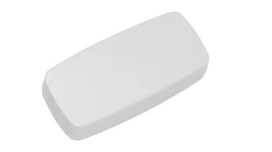 Sensor in der Farbe Weiß länglich vor einem hellen Hintergrund.